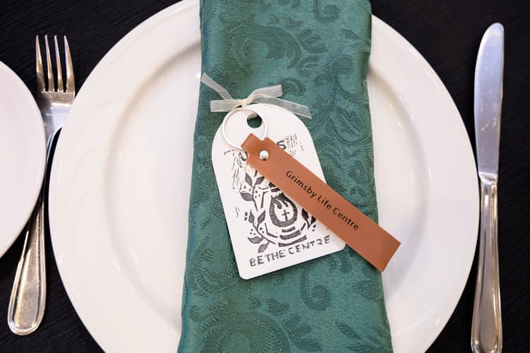 a table setting at a fundraiser event